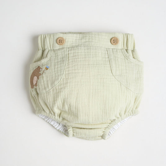 Cubrepañales de oso mostrando tejido suave y elástico para bebés