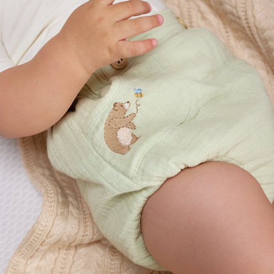 Cubrepañales con diseño de oso y broches ajustables