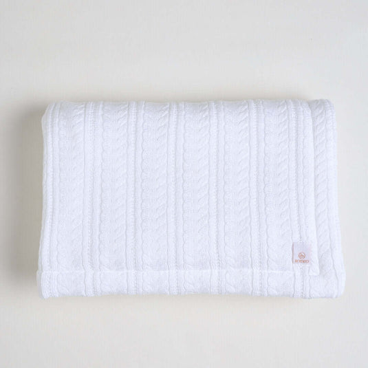 Manta ovejera blanca para bebé con textura suave y diseño esponjoso
