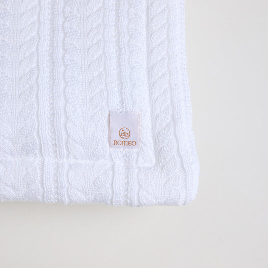 Detalle del tejido de la manta ovejera blanca mostrando su pelo rizado